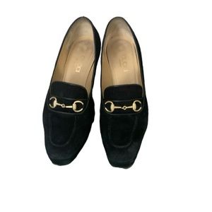 Gucci black suede shoes with gold accents